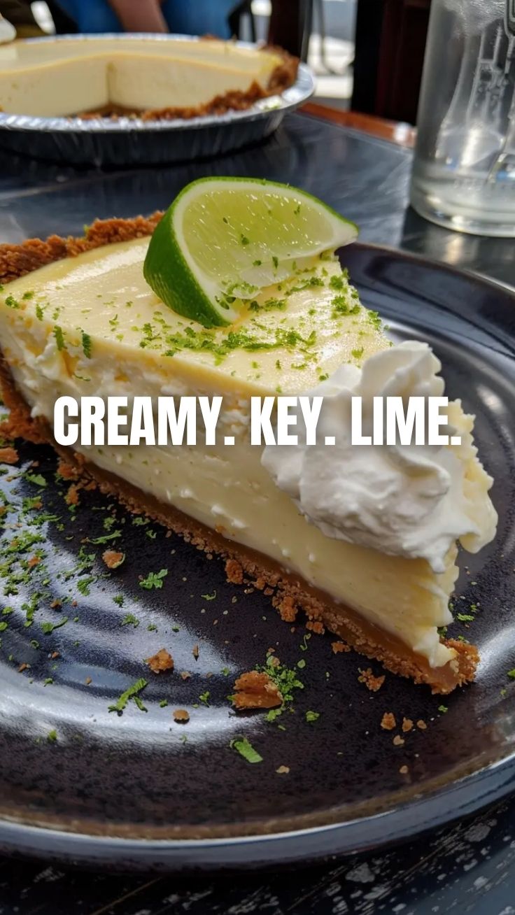 A vibrant slice of key lime pie with a graham cracker crust and whipped cream.