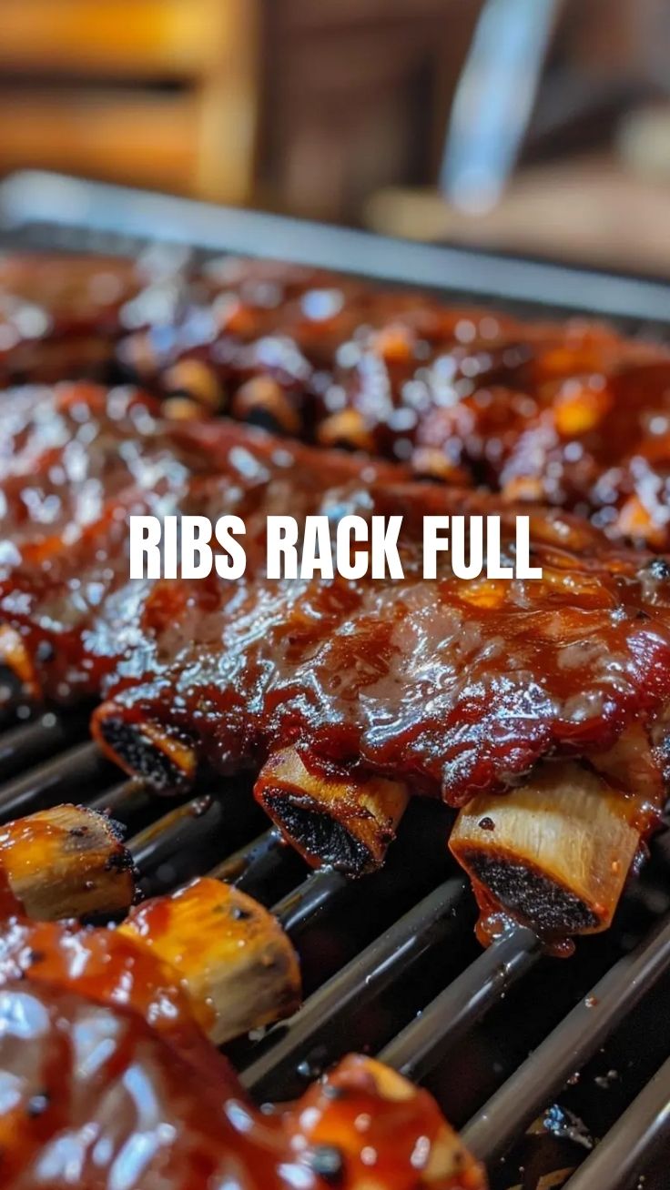 A platter of perfectly grilled BBQ ribs with a glistening sauce.