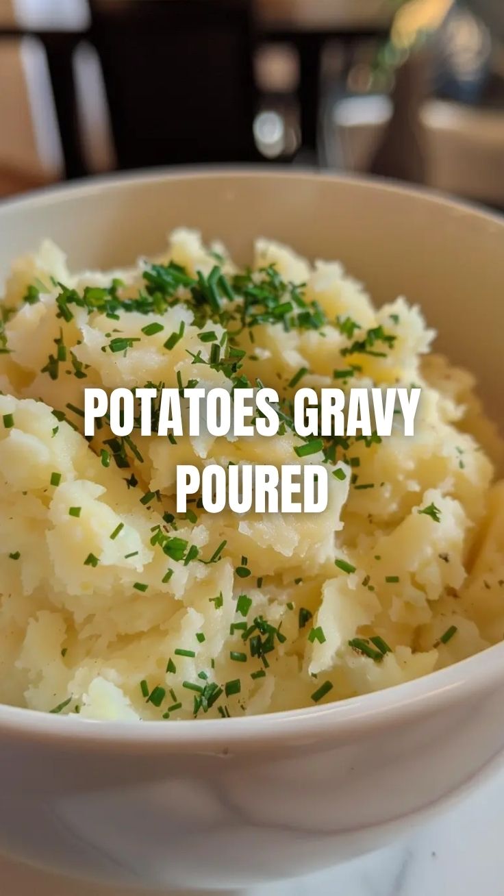 A bowl of perfectly cooked mashed potatoes, steaming slightly.