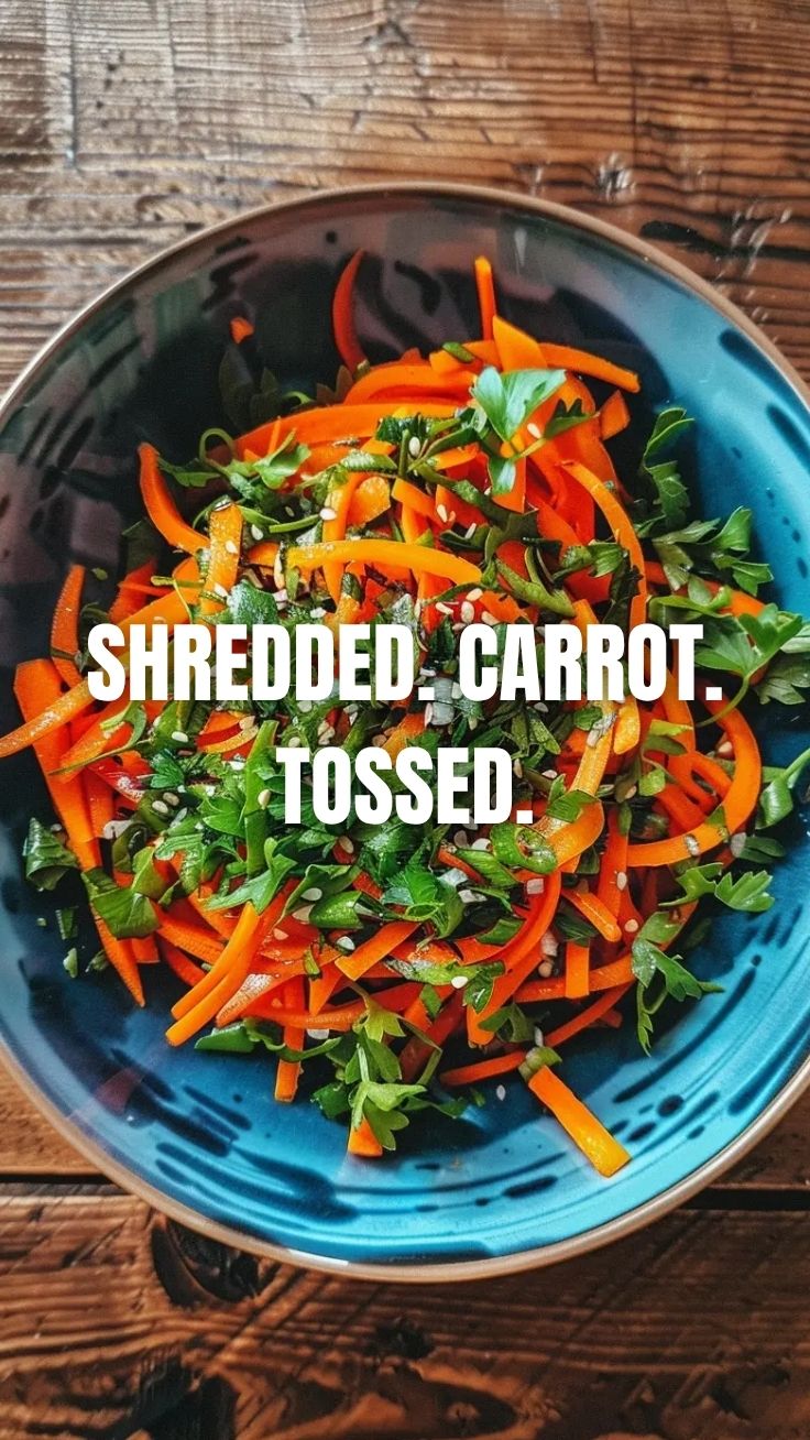 A vibrant bowl of the viral TikTok carrot salad, freshly prepared.