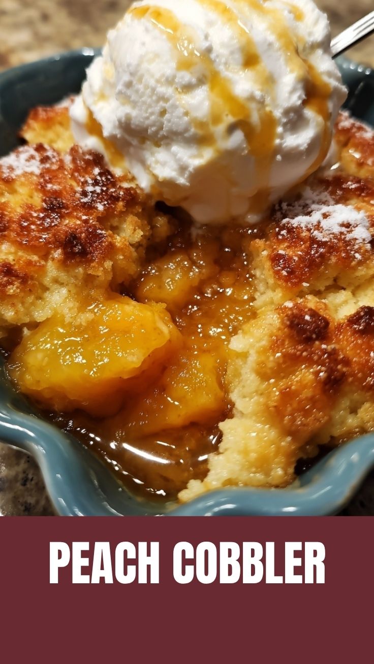 A hot peach cobbler with a golden-brown crust, served fresh from the oven.