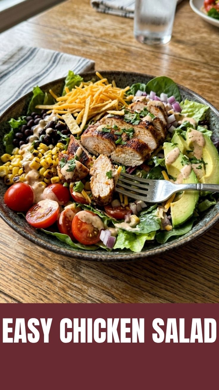 A vibrant Southwest chicken salad with corn, beans, and avocado