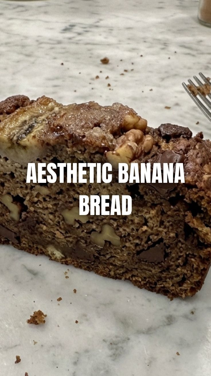 A freshly baked banana bread loaf on a cooling rack