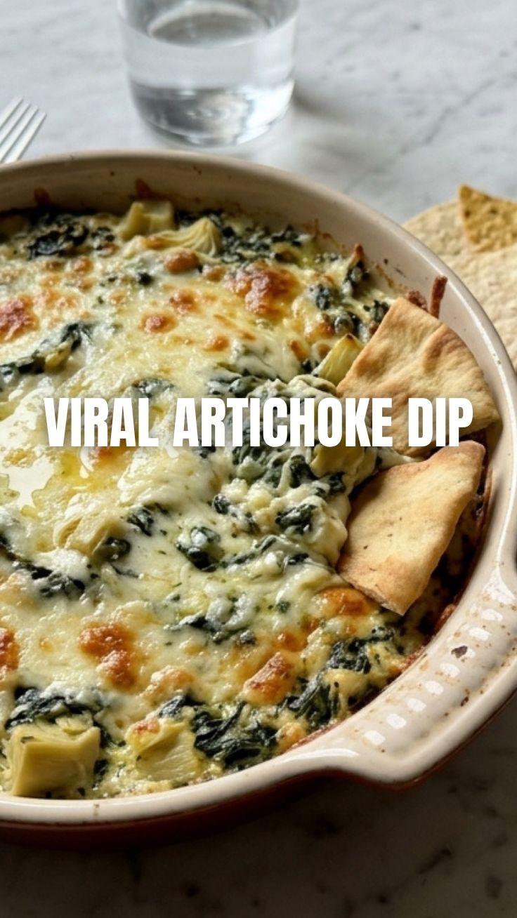 A bubbling hot spinach artichoke dip, freshly baked and golden brown.