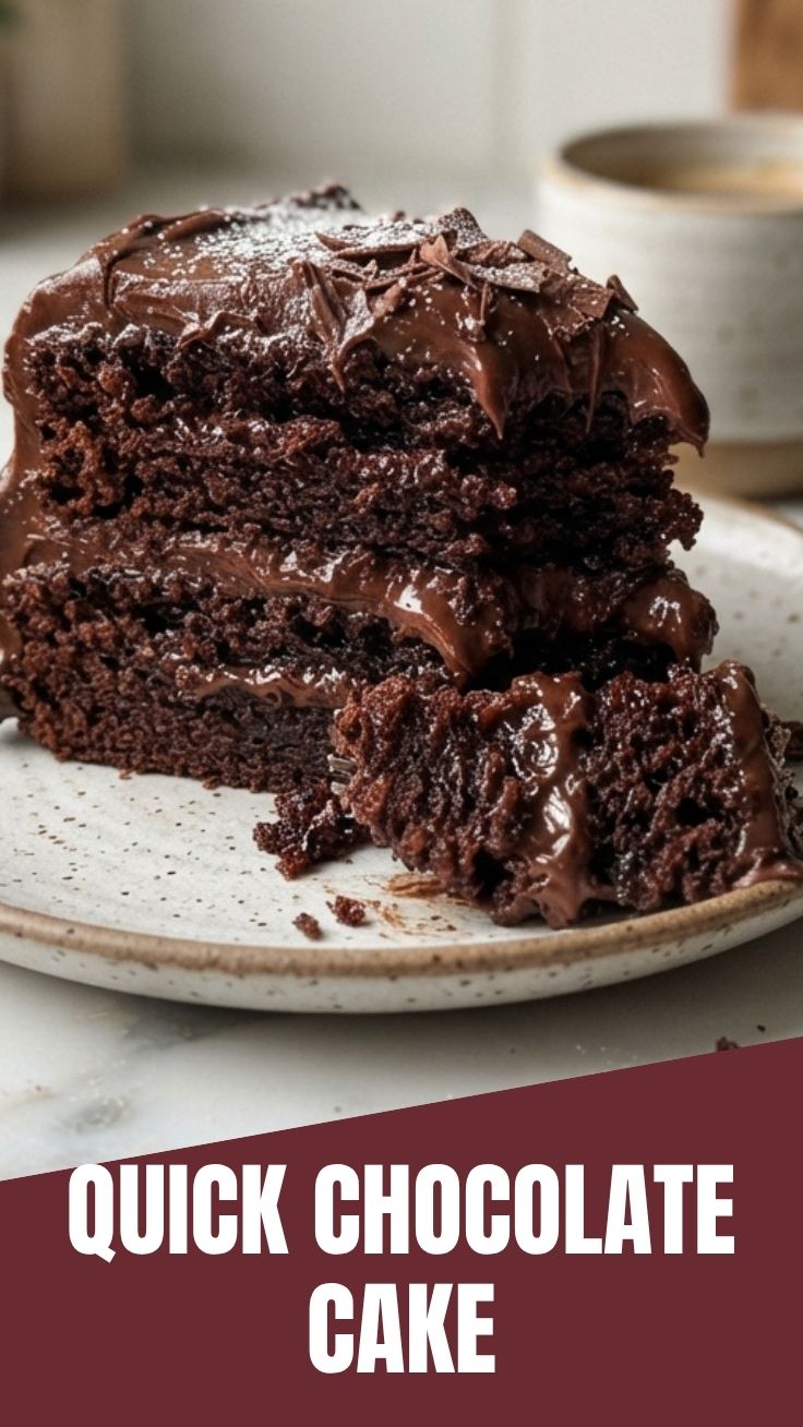 A full, rich chocolate cake, perfectly frosted and ready to serve.
