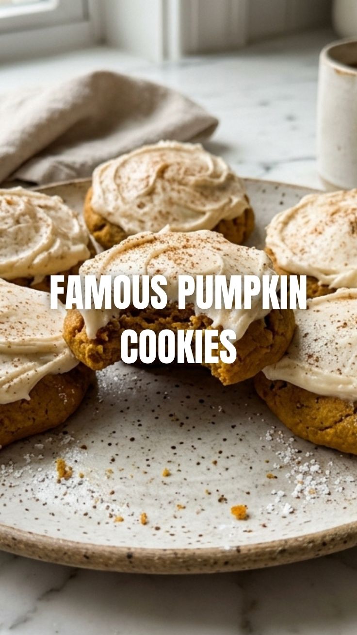A plate of freshly baked pumpkin cookies, perfectly golden brown.
