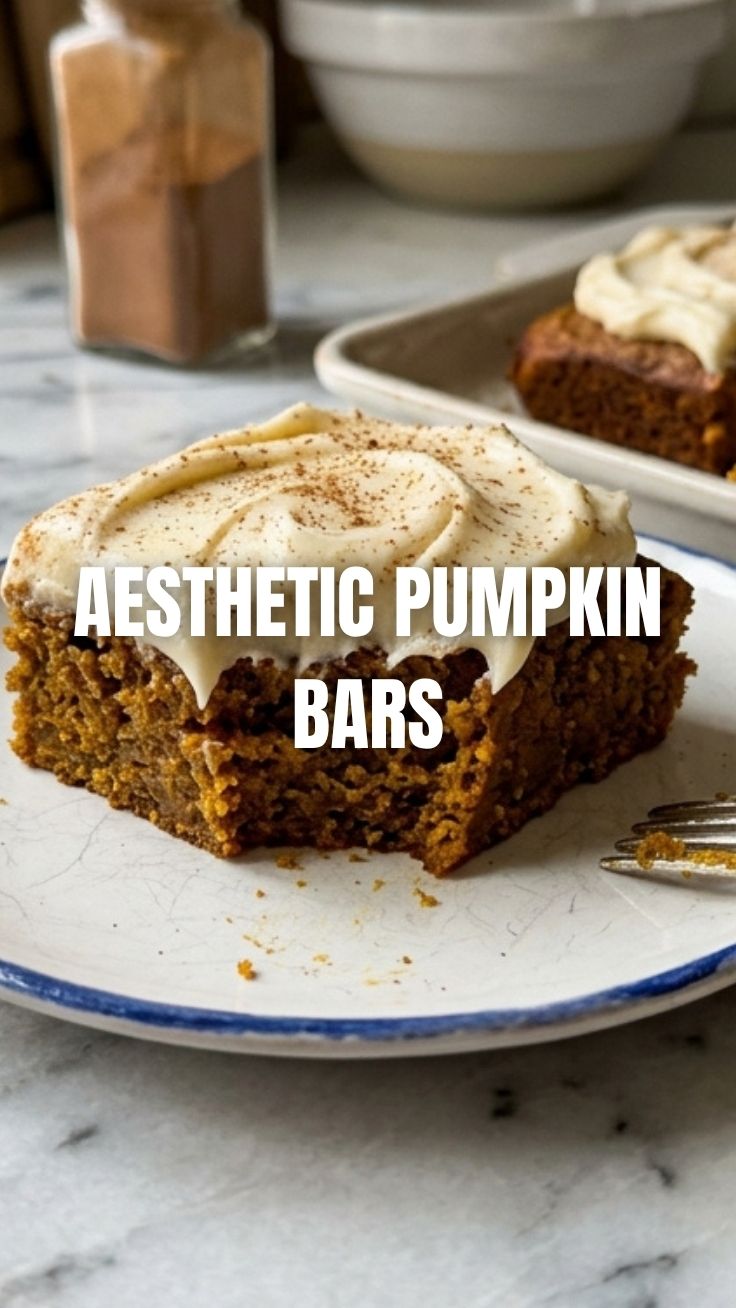 A tray of homemade pumpkin bars cooling on a wire rack.