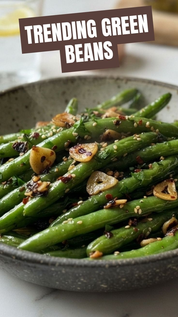 A serving of vibrant green beans tossed with minced garlic.