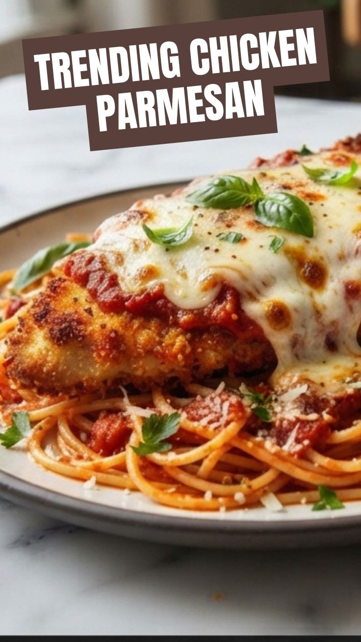 A serving of golden-brown chicken parmesan topped with melted cheese and marinara sauce.